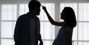 man and woman fighting in shadow