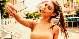 beautiful woman taking a selfie