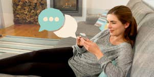 Woman texting on the couch
