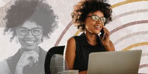 Woman happily working on her laptop