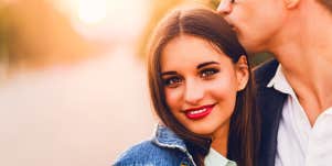Smiling woman close to man
