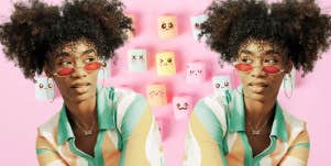 Woman with 'blinders' glasses on surrounded by different emotions