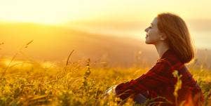 woman relaxing in grass