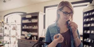 woman smelling essential oils