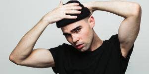 man with his hands on his head