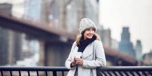 woman outside with coffee
