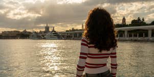 woman looking at lake