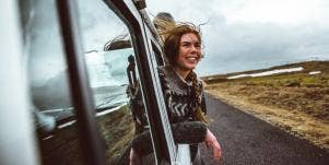 woman looking out of a van