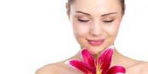 woman smelling flower