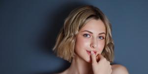 woman touching her lips