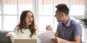 shocked woman with husband wondering about financial abuse