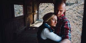 woman hugging man upset sad couple