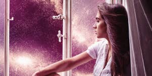 woman in window, looking at vibrant night sky, monochrome plum 