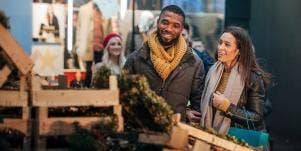 man and woman christmas tree shopping