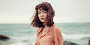 Sad woman by seaside