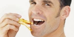 man eating fries