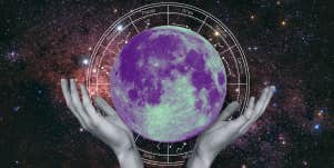 hands holding full moon, zodiac wheel