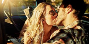 woman and man kissing passionately
