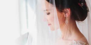 bride standing near window