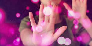 woman putting hand up