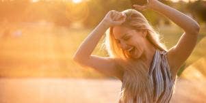 woman dancing in sunlight