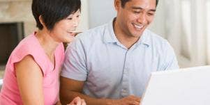 happy couple using computer
