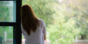 woman looking outside