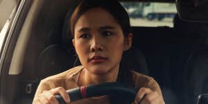 unhappy woman in car driving