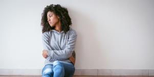 woman alone holding her hands