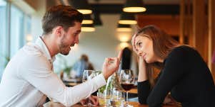 man and woman arguing at dinner