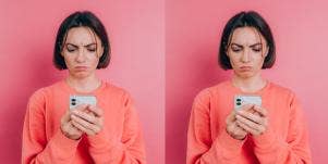 woman in monochrome pink looking at phone