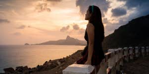 woman looking at sunset