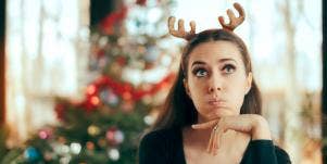 woman wearing antlers celebrating Christmas