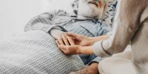 Old man in hospital bed