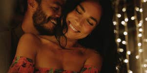 smiling couple cuddling