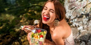 woman eating salad