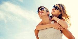 woman on shoulders of men 