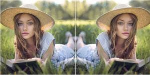 mirrored image of woman reading on the grass