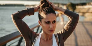 woman doing a messy bun