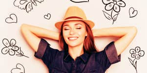 Woman reclining with symbols of happiness around her