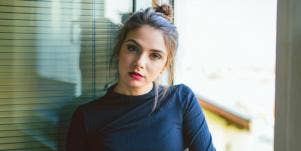 stern woman looking forward in turtleneck