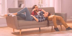 woman and man lying on the couch