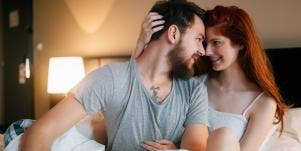 man and woman in bed