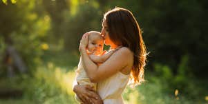 mom kissing baby