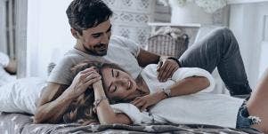 Couple laying on bed