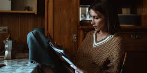 woman reading papers