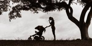 sad mother with baby in stroller