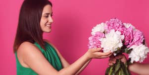 woman receiving flower