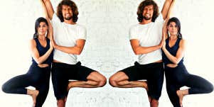 smiling man and woman in yoga pose