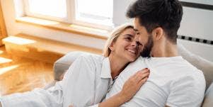 woman cuddling with man